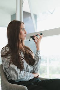 Sitting Businesswoman Talking on Phone